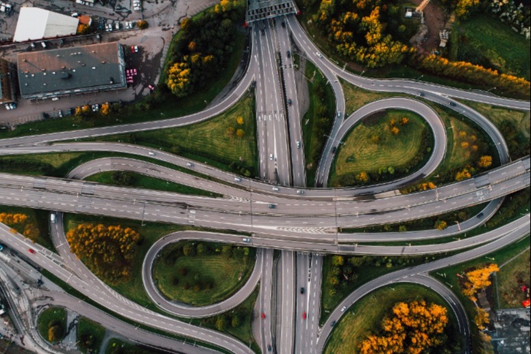 aerial-shot-twisted-roads-surrounded-by-parks-middle-city-1